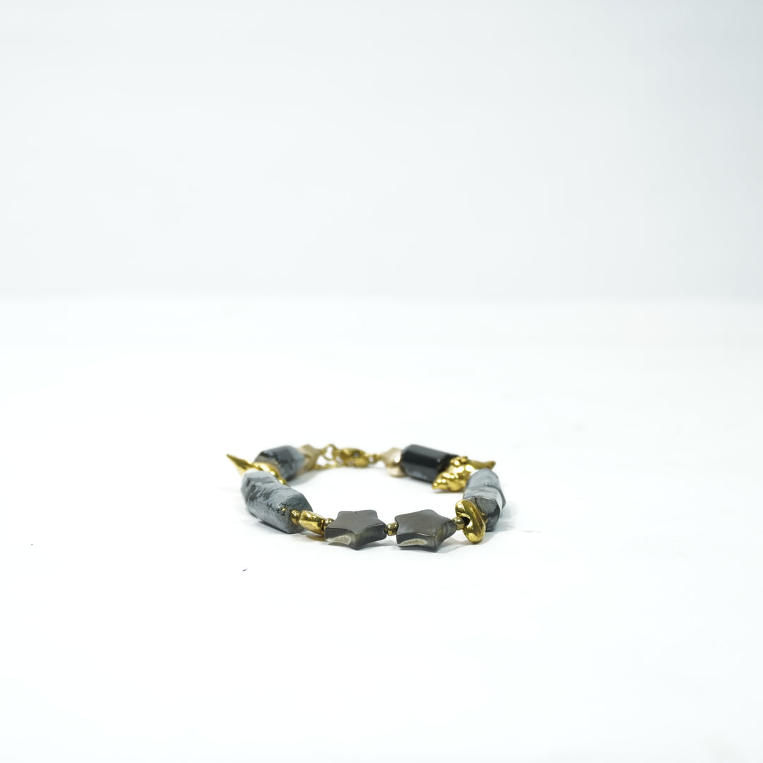 Snowflake Obsidian Bracelet: Lotus and Conch Charms