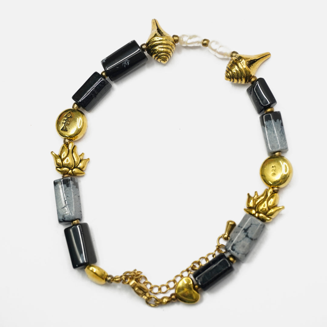 Snowflake Obsidian Bracelet: Conch and Lotus Charms