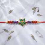 Load image into Gallery viewer, Auralite & Red Carnelian Peacock Charm Rakhi