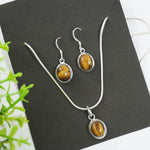 Load image into Gallery viewer, Tiger&#39;s Eye Silver Pendant and Earrings - Oval
