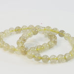 Load and play video in Gallery viewer, Golden Rutile Quartz Bracelet - Round Beads 8mm
